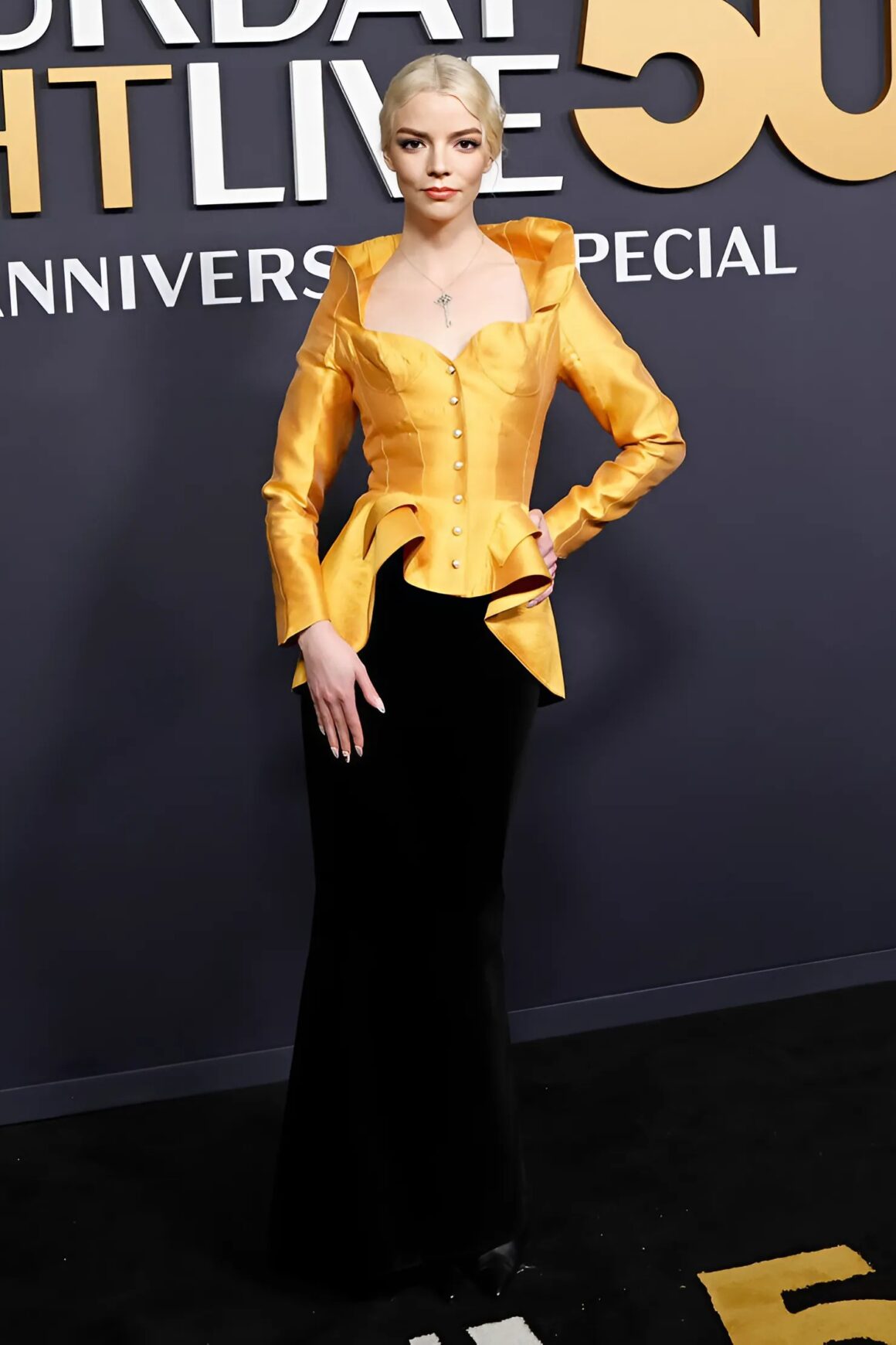 Anya Taylor-Joy wears a yellow and black vintage Thierry Mugler dress to the SNL 50 show